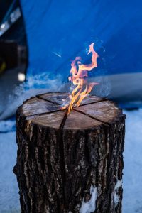 Ice fishing fire log on Lake Winnipeg