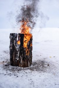 Fire log burning on Lake Winnipeg