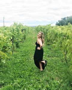 Shanley Gibb poses in a vineyard for Instagram