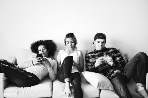 Generation z browsing social media on their smartphones
