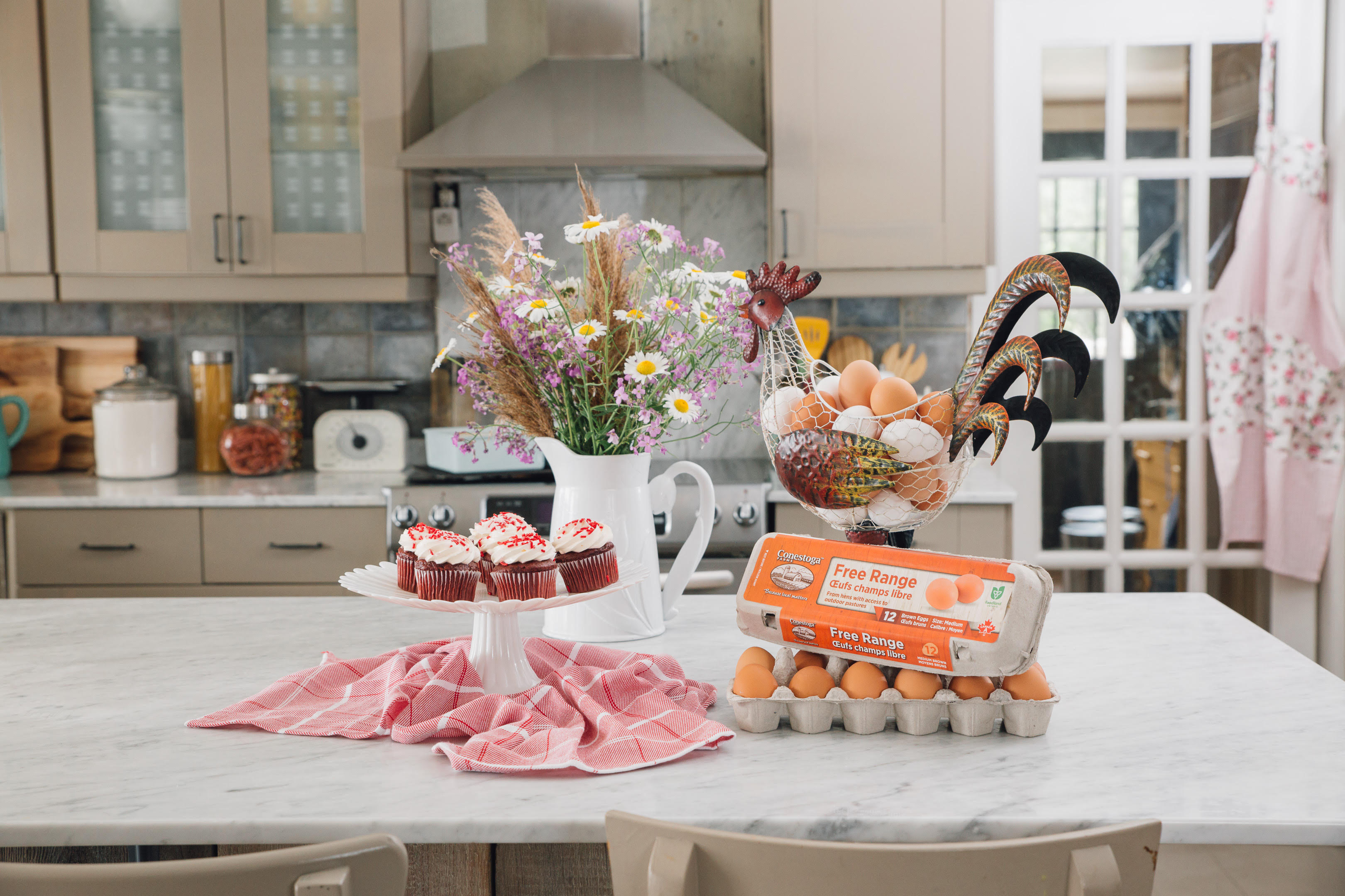 Conestoga Farms Free Range Eggs in a kitchen with baked cupcakes