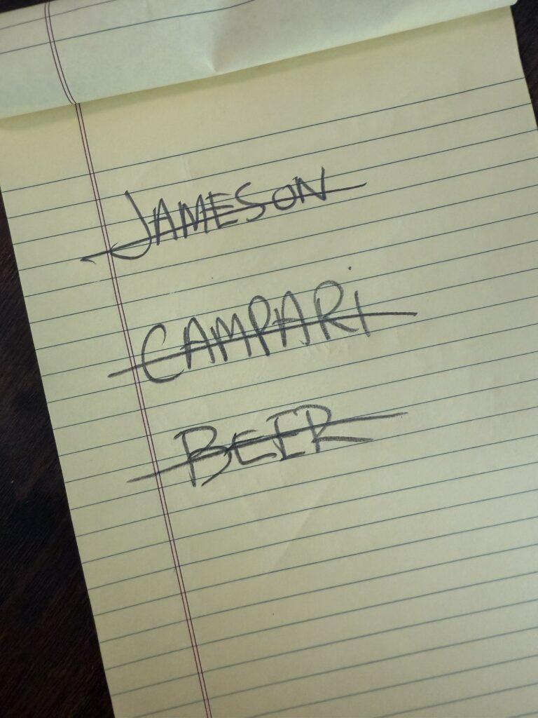 Jameson, Campari and beer crossed off a notepad list