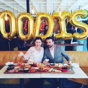 Sean Beckingham and Marian Staresinic at a food launch event standing behind a large charcuterie board, showcasing Branding & Buzzing’s hands-on approach to food and beverage marketing